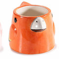 Vaso in ceramica colorata lucida con volto di pappagallo